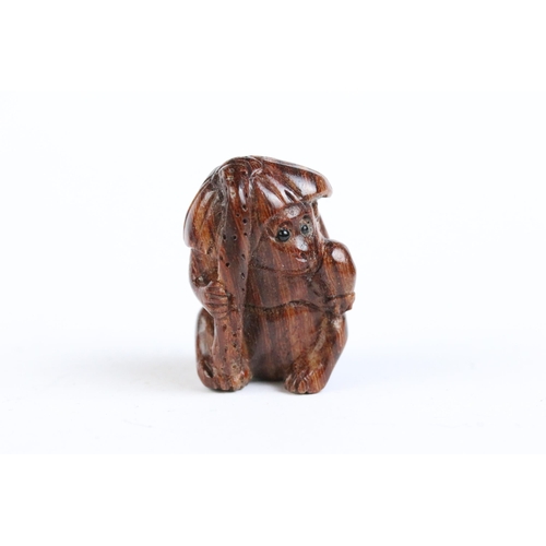 108 - Three miniature wood netsuke figures to include monkey, Chinese dragon and a signed rabbit