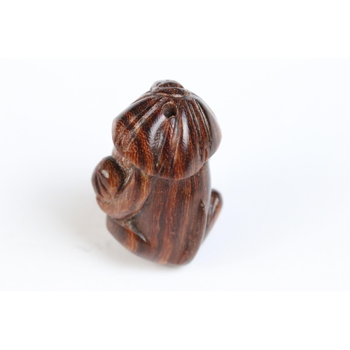 108 - Three miniature wood netsuke figures to include monkey, Chinese dragon and a signed rabbit