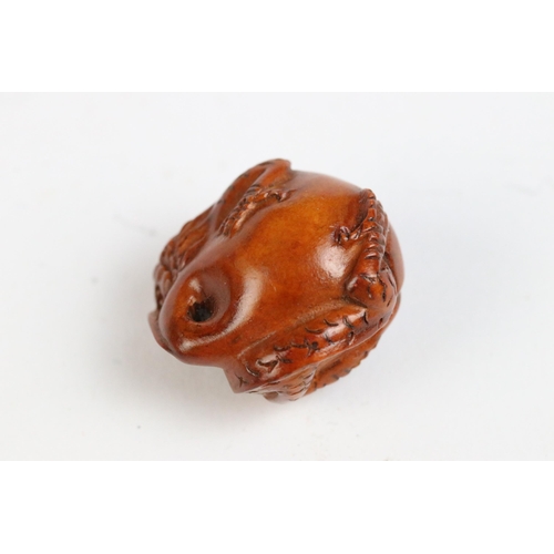 108 - Three miniature wood netsuke figures to include monkey, Chinese dragon and a signed rabbit