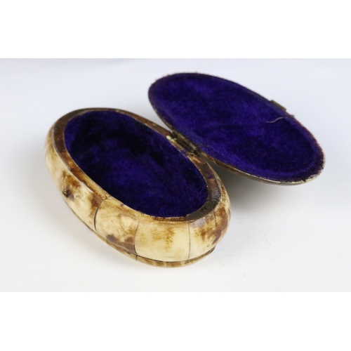 118 - A collection of three North African carved bone trinket boxes with brass decoration.