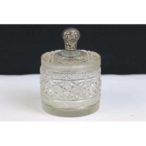 120 - A collection of three hallmarked silver topped cut glass vanity jars together with a collection of s... 