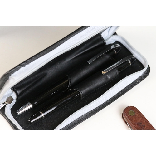 128A - A small group of collectables to include a box camera, three penknives and a pen set.