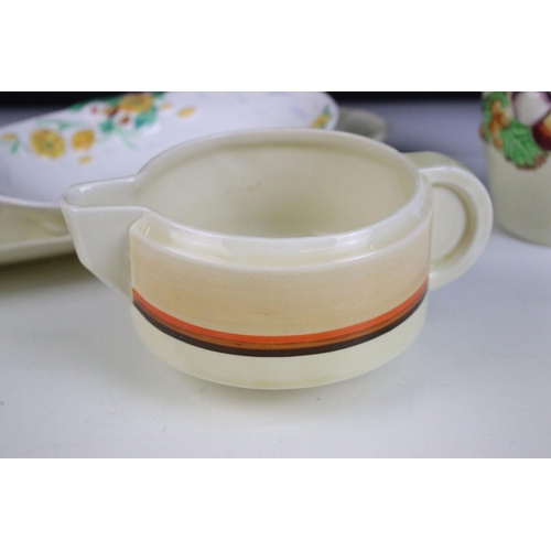 55 - Clarice Cliff banded odilon shape gravy boat, together with 'Spring time' soap dish, crocus hand pai... 