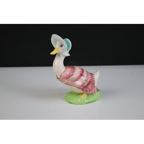 57 - Group of Beswick Beatrix Potter figurines to include Hunca Munca Sweeping No.1,043 of 1,947, Jeremy ... 