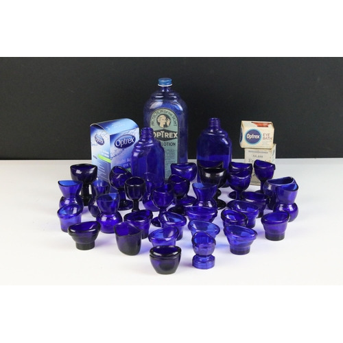 67 - Collection of 20th century Optrex blue glass eyebaths in various designs together with related acces... 