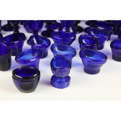 67 - Collection of 20th century Optrex blue glass eyebaths in various designs together with related acces... 