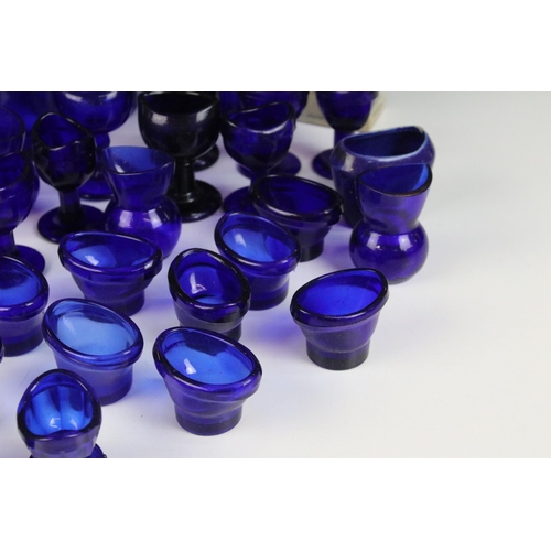 67 - Collection of 20th century Optrex blue glass eyebaths in various designs together with related acces... 