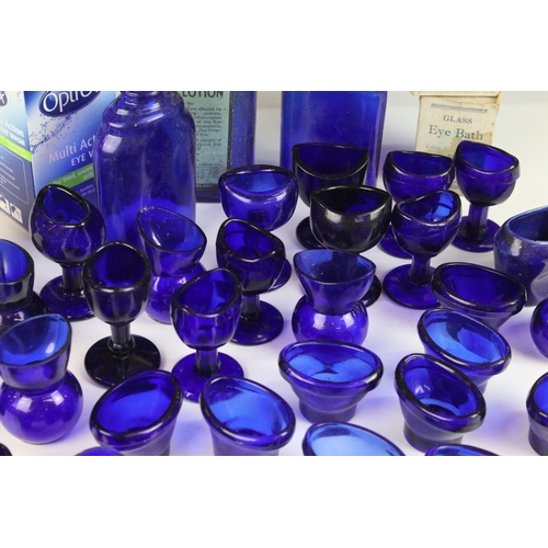 67 - Collection of 20th century Optrex blue glass eyebaths in various designs together with related acces... 