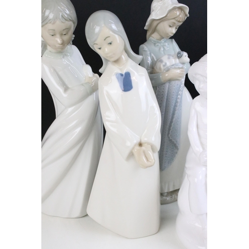 69 - Selection of Lladro Nao figurines to include dancing girl, girl with puppy, girl with blanket, child... 