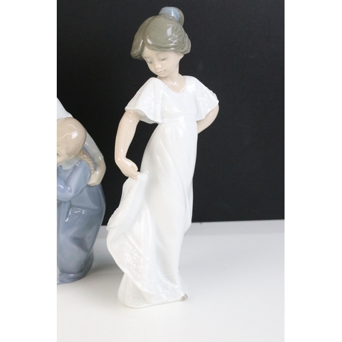 69 - Selection of Lladro Nao figurines to include dancing girl, girl with puppy, girl with blanket, child... 