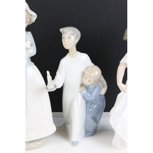 69 - Selection of Lladro Nao figurines to include dancing girl, girl with puppy, girl with blanket, child... 