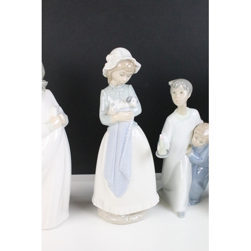 69 - Selection of Lladro Nao figurines to include dancing girl, girl with puppy, girl with blanket, child... 