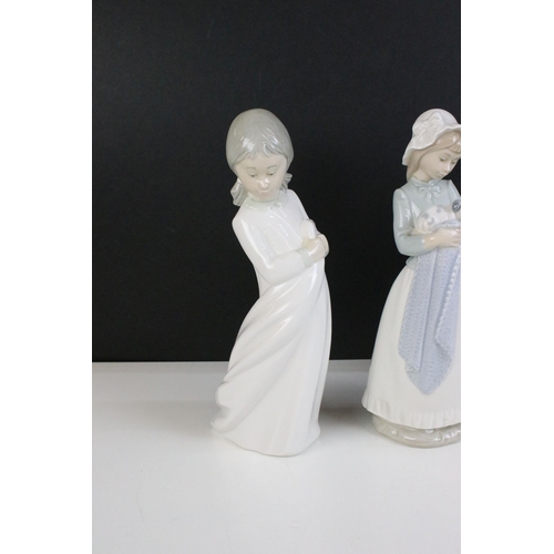 69 - Selection of Lladro Nao figurines to include dancing girl, girl with puppy, girl with blanket, child... 