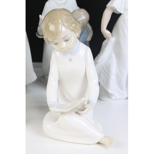 69 - Selection of Lladro Nao figurines to include dancing girl, girl with puppy, girl with blanket, child... 