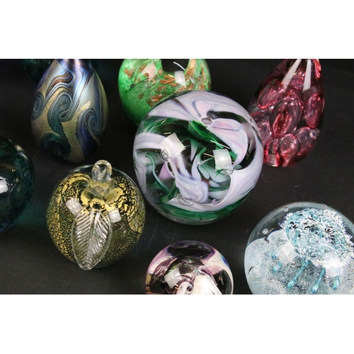 73 - Quantity of decorative paperweights to include Caithness 'Checkpoint', 'Moon crystal', 'Marquee', La... 