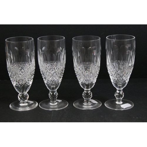 77 - Set of four Waterford crystal champagne flutes, H 15cm together with a mid century dessert glass wit... 