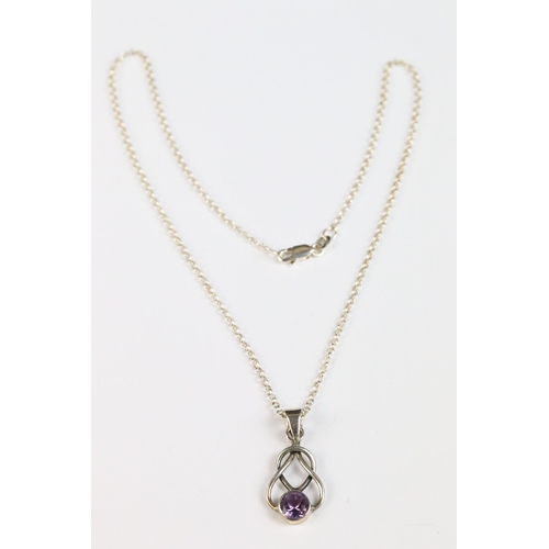 86 - Silver knot pendant set with an amethyst coloured stone on silver chain, silver gilt ‘ world ‘ penda... 