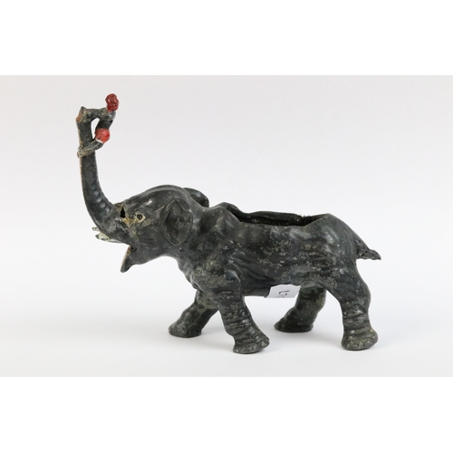 87 - A French spelter ink pen nib cleaner modelled as a elephant with young boy climbing trunk.