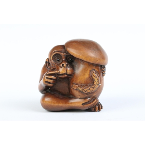 97 - A group of four fruit wood signed netsuke.