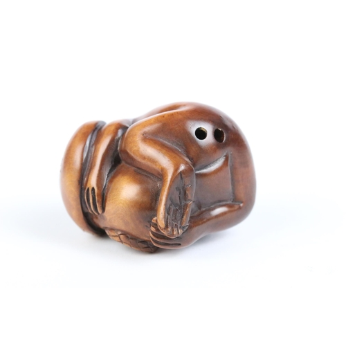 97 - A group of four fruit wood signed netsuke.