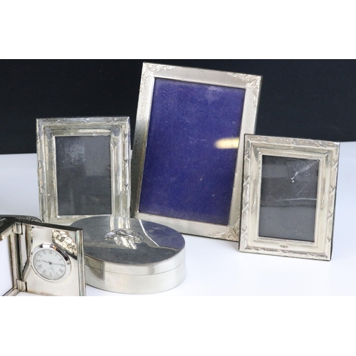 98 - A collection of silver and white metal items including photograph frames.