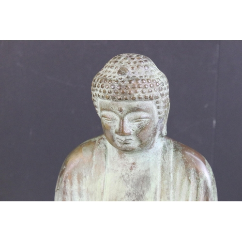 183 - Bronze Buddha sat on wooden base, measures approx. H 30cm