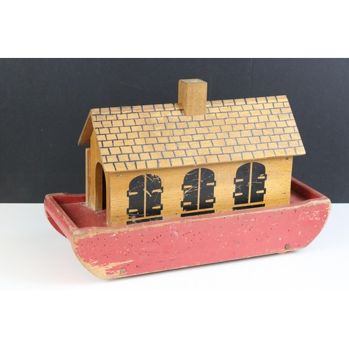 184 - Vintage wooden part painted Noah’s Ark with lift off lid and raised on roller wheels, havingtwelve w... 