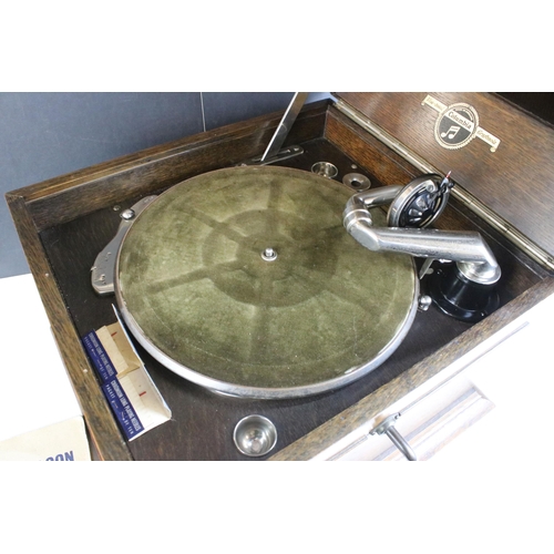 189 - Columbia Viva-tonal Grafonola oak cased wind up gramophone together with four records, H 45cm, W 48.... 