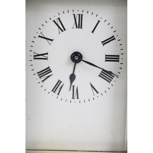 194 - Early 20th century brass carriage clock with handle H 11.5cm, W 7.5cm, D 6.5cm