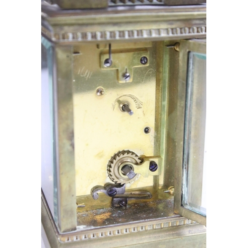 194 - Early 20th century brass carriage clock with handle H 11.5cm, W 7.5cm, D 6.5cm