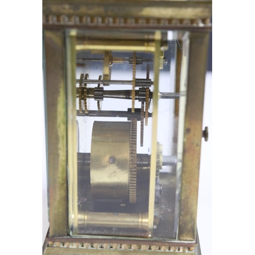 194 - Early 20th century brass carriage clock with handle H 11.5cm, W 7.5cm, D 6.5cm