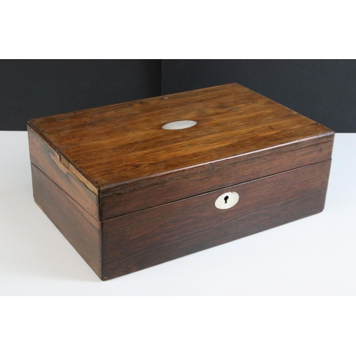 203 - Early 20th century wooden writing slope box with inlayed mother of pearl detail with an interior red... 