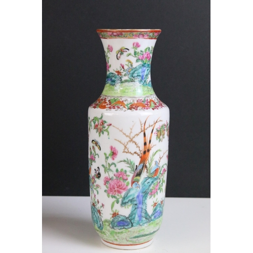 206 - Pair of famille rose vases depicting scenes of exotic birds and insects in the wild, H 25cm