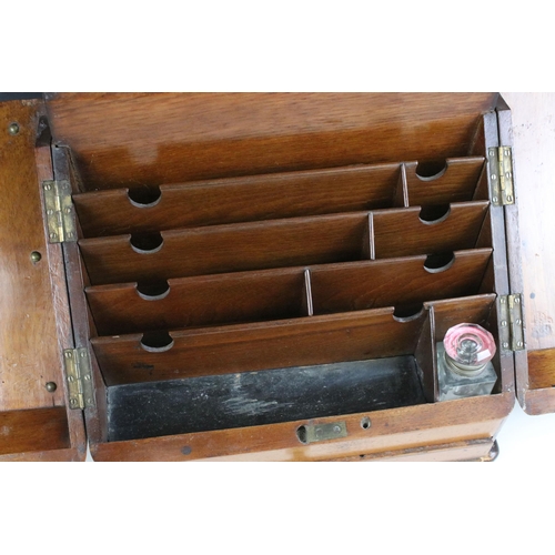 212 - Edwardian walnut stationary box featuring interior letter dividers, long drawer, pen rest and glass ... 