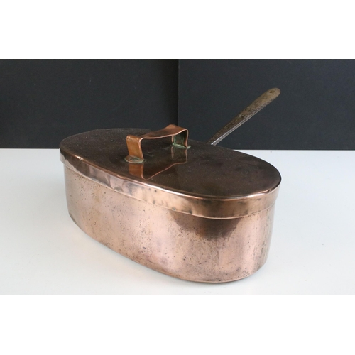 215 - 19th century copper oval saucepan with lid and cast iron handle, 33cm long