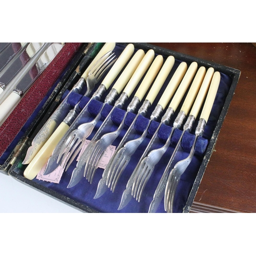 219 - Two canteens and a collection of boxed silver plate cutlery