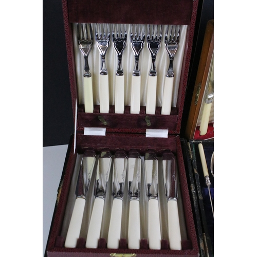 219 - Two canteens and a collection of boxed silver plate cutlery