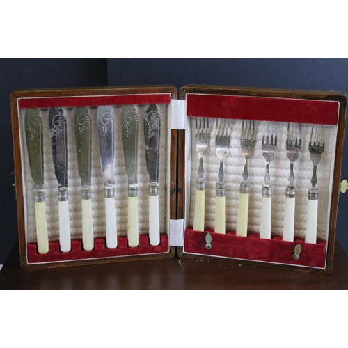 219 - Two canteens and a collection of boxed silver plate cutlery