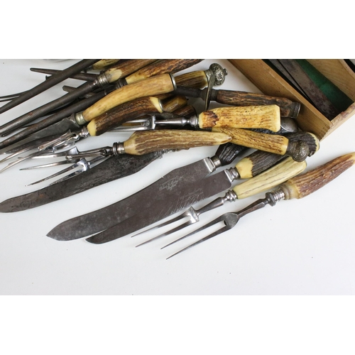 228 - Large selection of antler carving set items along with a pair of decorative detail oriental spoons, ... 