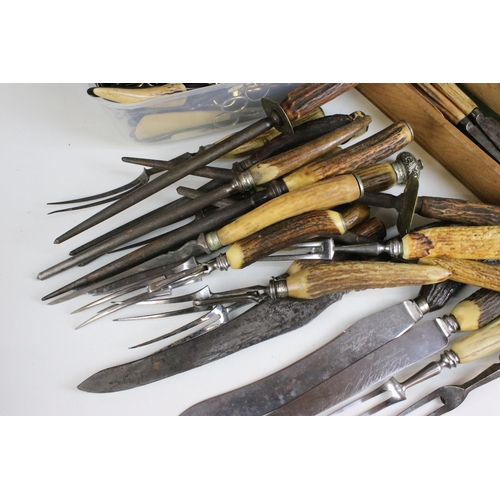 228 - Large selection of antler carving set items along with a pair of decorative detail oriental spoons, ... 