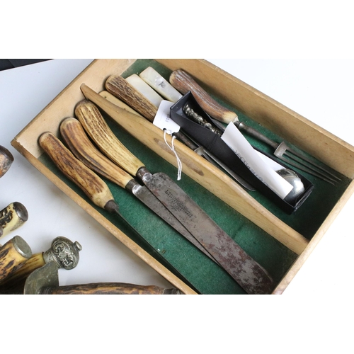 228 - Large selection of antler carving set items along with a pair of decorative detail oriental spoons, ... 