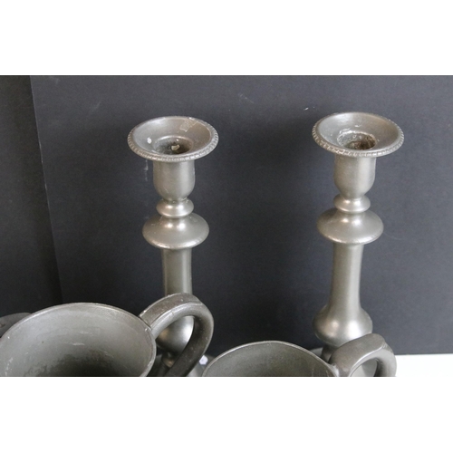 253 - Quantity of pewter items to include a pair of candlesticks, tankards of varying sizes, some with gla... 