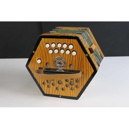 255 - German Scholer concertina, 21 buttons, with floral borders, checked lining, green bellow and decorat... 