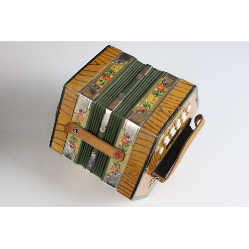 255 - German Scholer concertina, 21 buttons, with floral borders, checked lining, green bellow and decorat... 