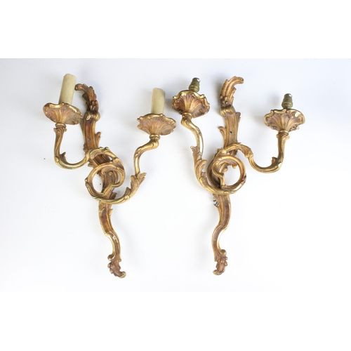 266 - Pair of urn topped wall sconce light fittings with double branches together with a pair of gilt meta... 