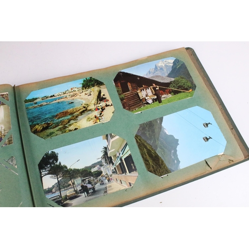 295 - Collection of postcards and greetings cards across three albums to include one large album of greeti... 