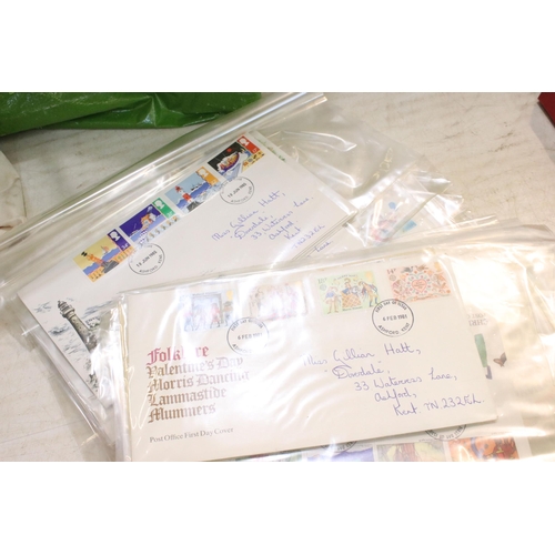 296 - Collection of stamps and postcards to include a selection of first day covers loose on envelopes, an... 