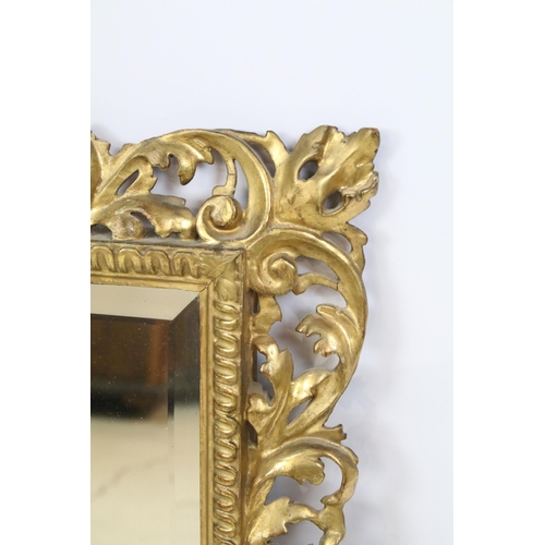 466 - Late 19th century giltwood mirror, the pierced border moulded with foliage and shells, with bevelled... 