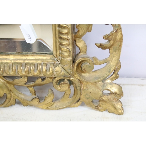 466 - Late 19th century giltwood mirror, the pierced border moulded with foliage and shells, with bevelled... 