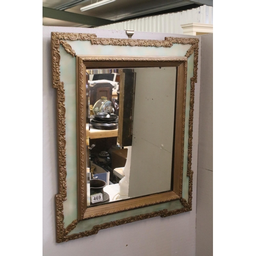 469 - 20th Century wall mirror of rectangular form with a bevelled glass panel to centre with green glass ... 